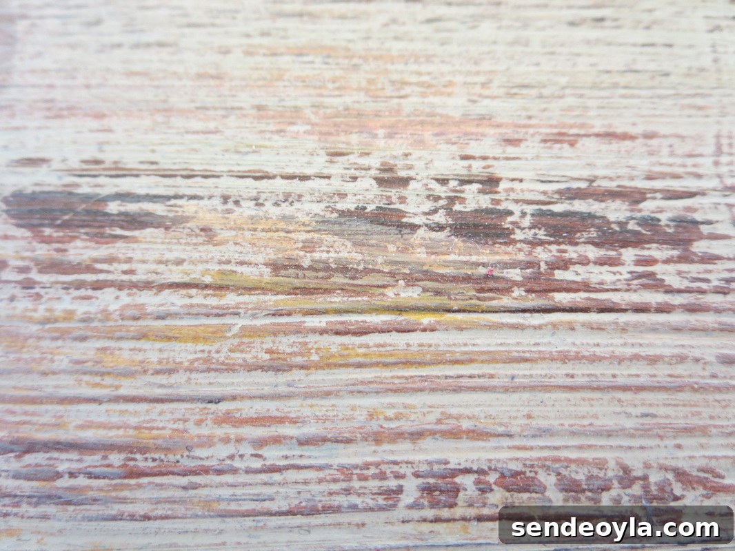 close up of the paint made to look like old wood, Seeing Red www.theboondocksblog.com