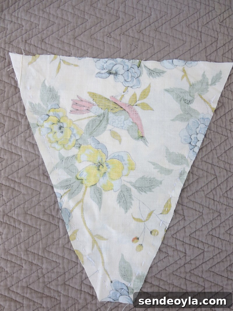 How to Make a Banner That Pops on a Blue Wall 4 cutting the fabric into triangles, A banner for the blue wall www.theboondocksblog.com