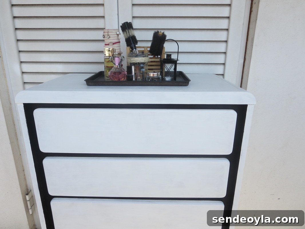 DIY Dresser Makeover: Paint and Decorative Paper Tutorial 10 Black paint on dresser