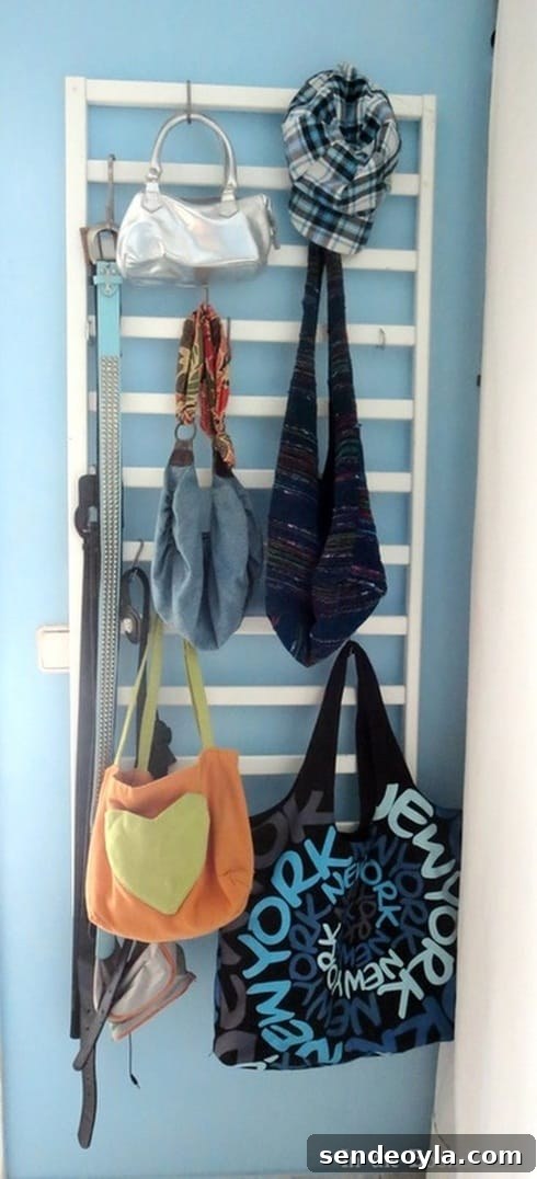 After the makeover with repurposed crib rail and hooks