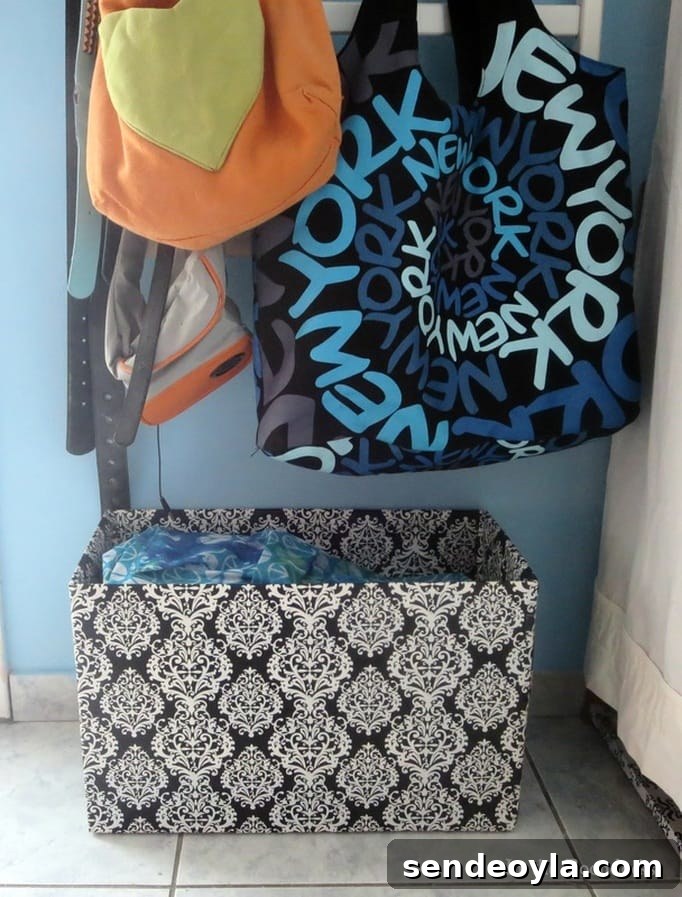 Bags and a storage box placed at the bottom of the hanging corner