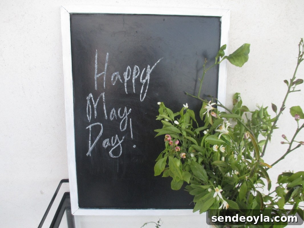 Happy May Day: Greek Wishes and Traditions 3 Blackboard on table with flowers, Happy May Day