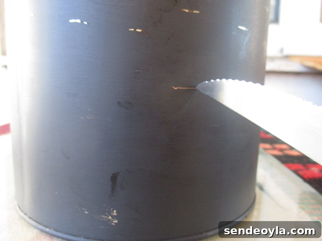 Imperfect Kitchen Utensil Holder with Rustic Charm 4 Scratching lines into the painted tin