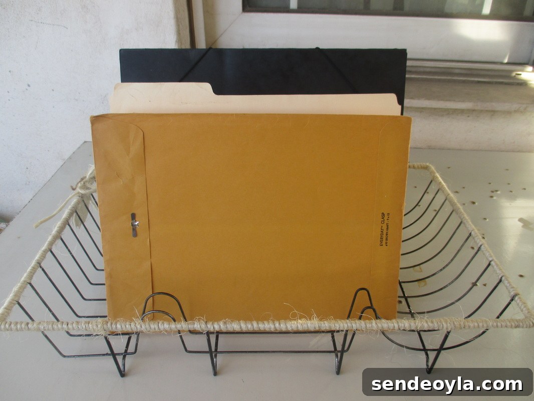 Dish rack wrapped with twine used as a file holder - Wrapping up the dish rack - The boondocks blog