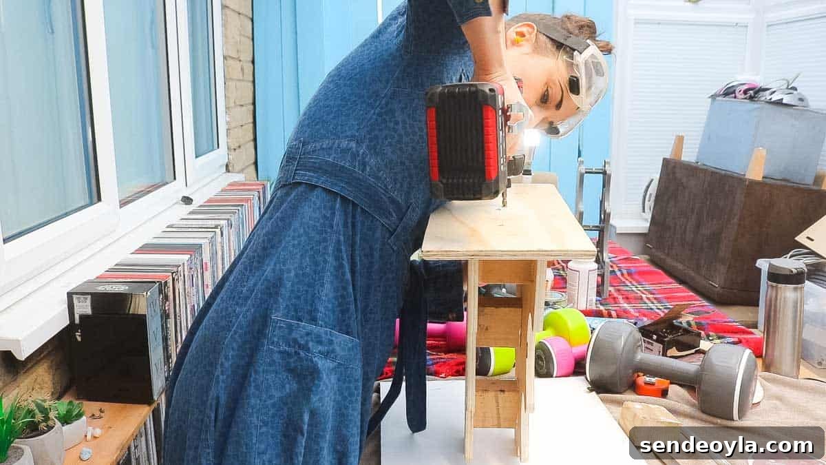 DIY Dumbbell Rack Tree Stand with Free Plans 13 The Carpenter's Daughter gluing and screwing a base for a dumbbell set rack