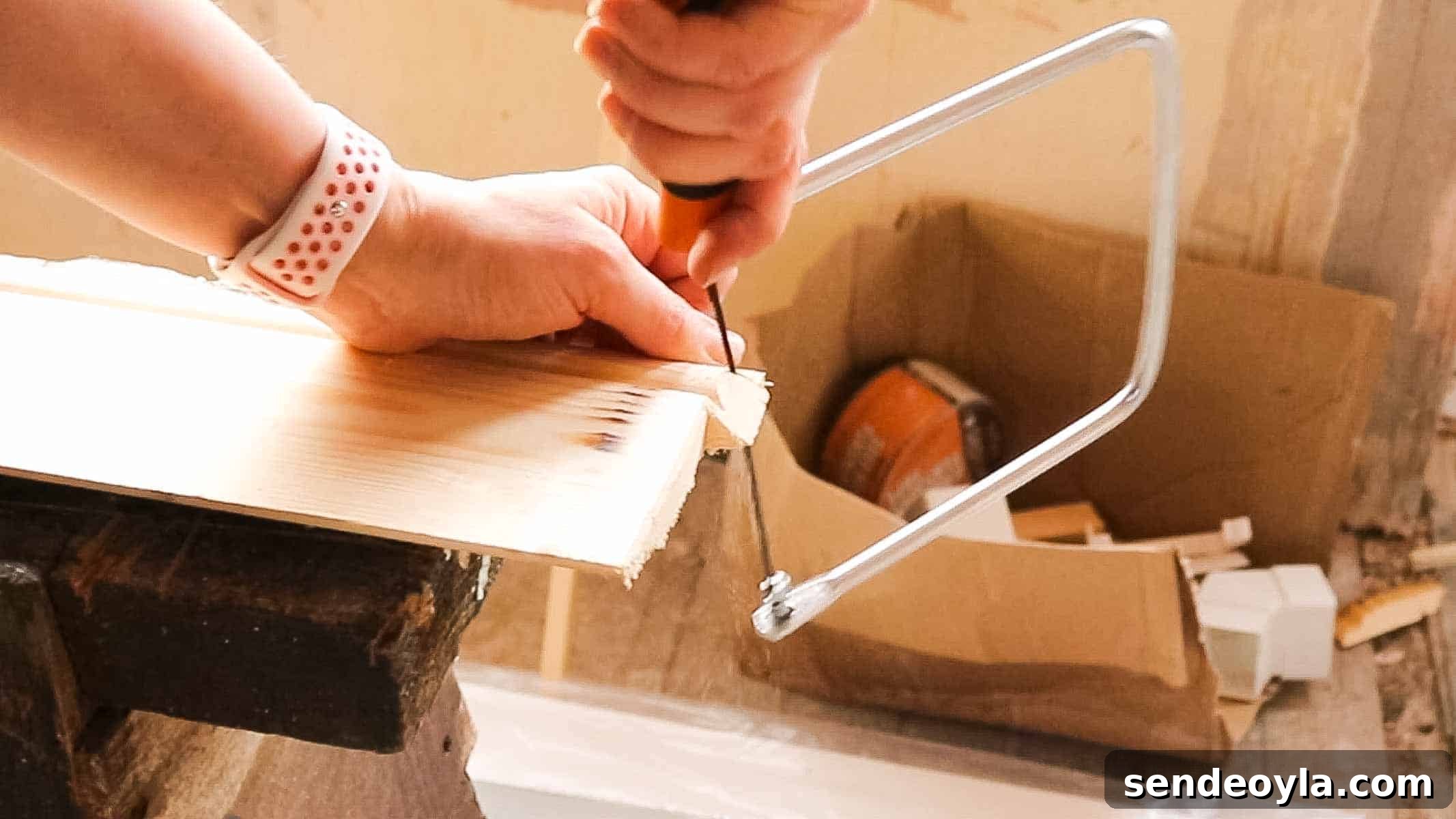 DIY Dumbbell Rack Tree Stand with Free Plans 7 woman using a coping saw for demonstration purposes on a previous skirting board prpject