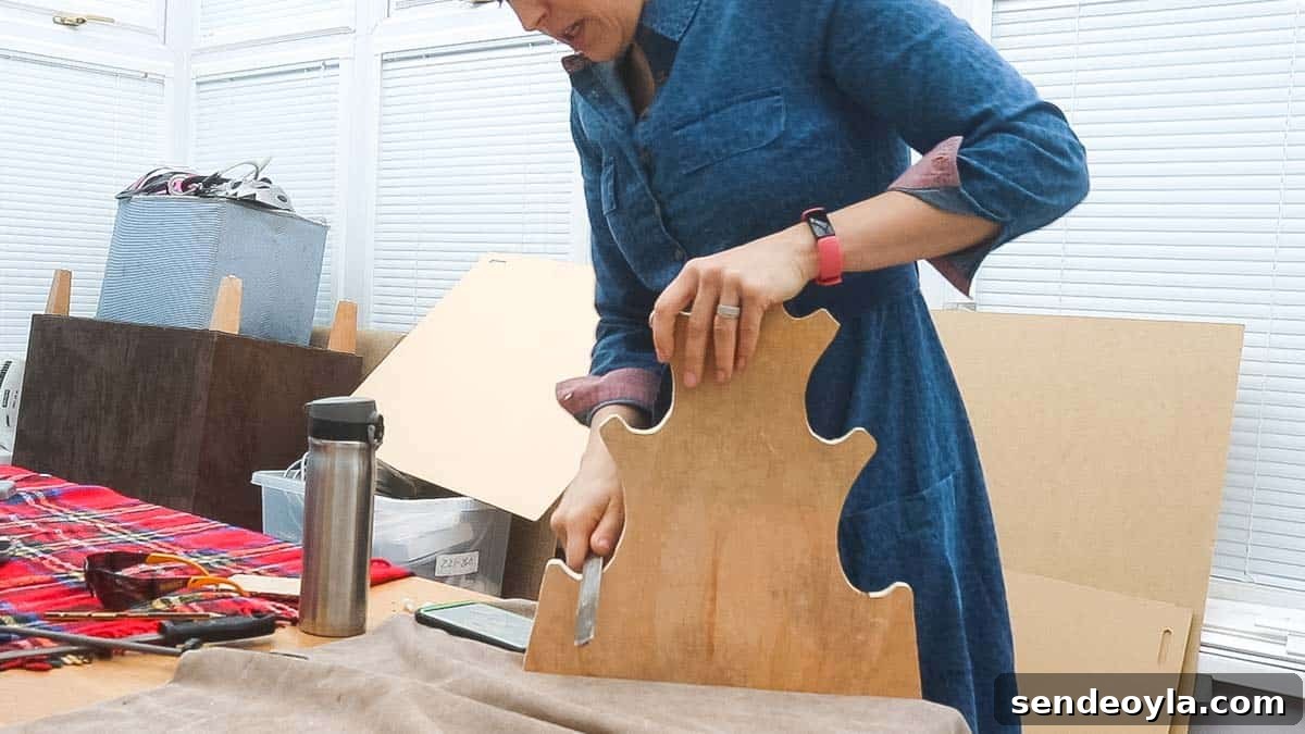DIY Dumbbell Rack Tree Stand with Free Plans 8 Woman filing DIY dumbbell storage curves with a rasp until smooth