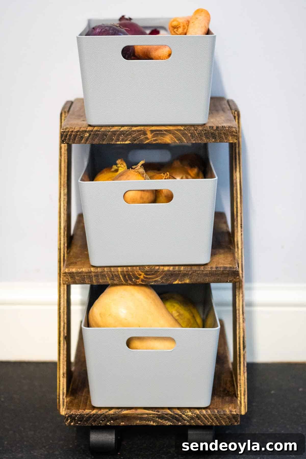 Wham Studio grey plastic boxes on a homemade wooden rolling stand with fruit and vegetables