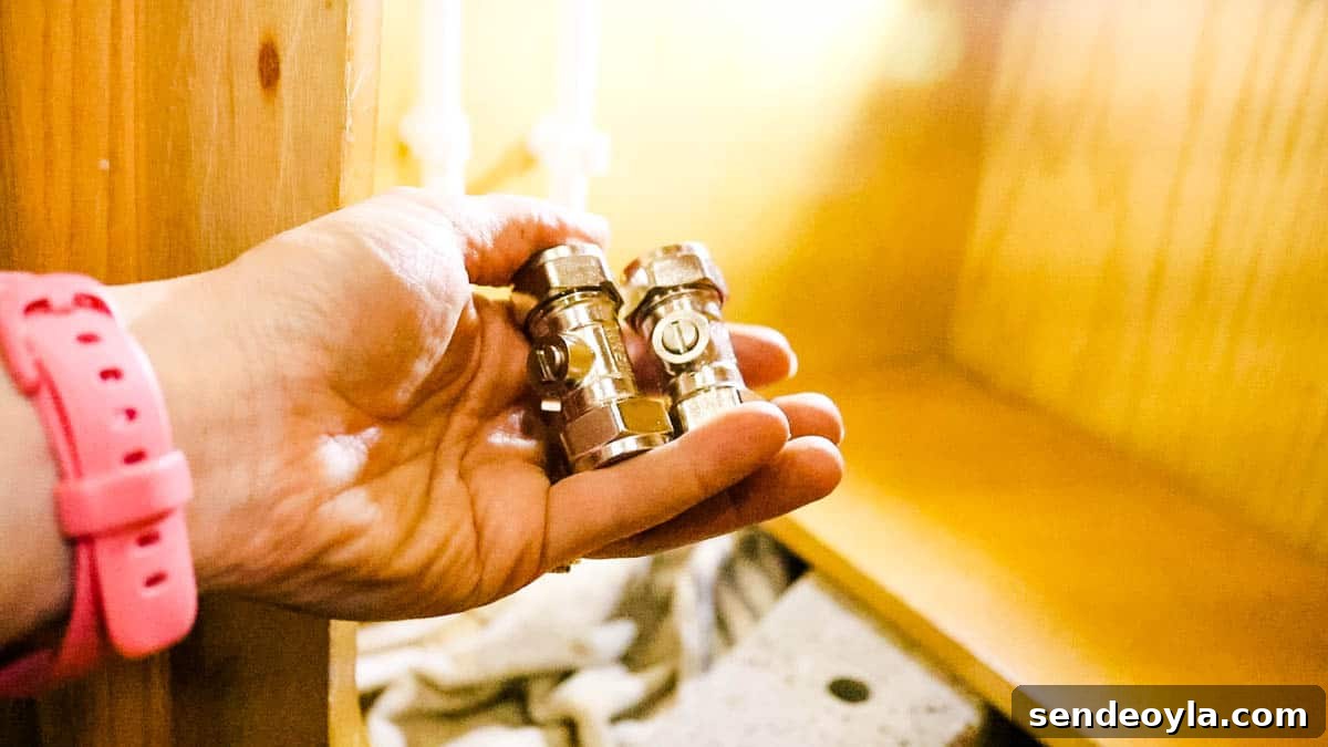 How to Replace a Mixer Tap on a Narrowboat or in Your Home 11 Picture of two brass isolation ball valves