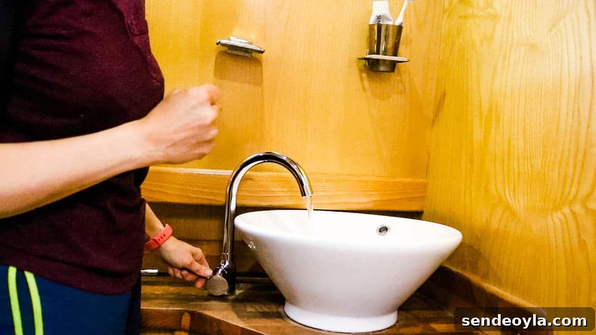 How to Replace a Mixer Tap on a Narrowboat or in Your Home 13 Tap turned on in a narrowboat bathroom to check the water flow