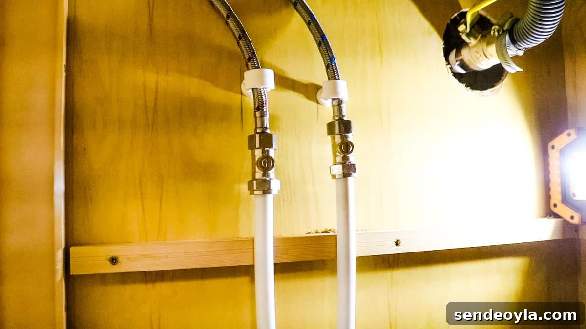 How to Replace a Mixer Tap on a Narrowboat or in Your Home 14 Final look of isolating valves connected to flexi tap tails and plastic plumbing pipes