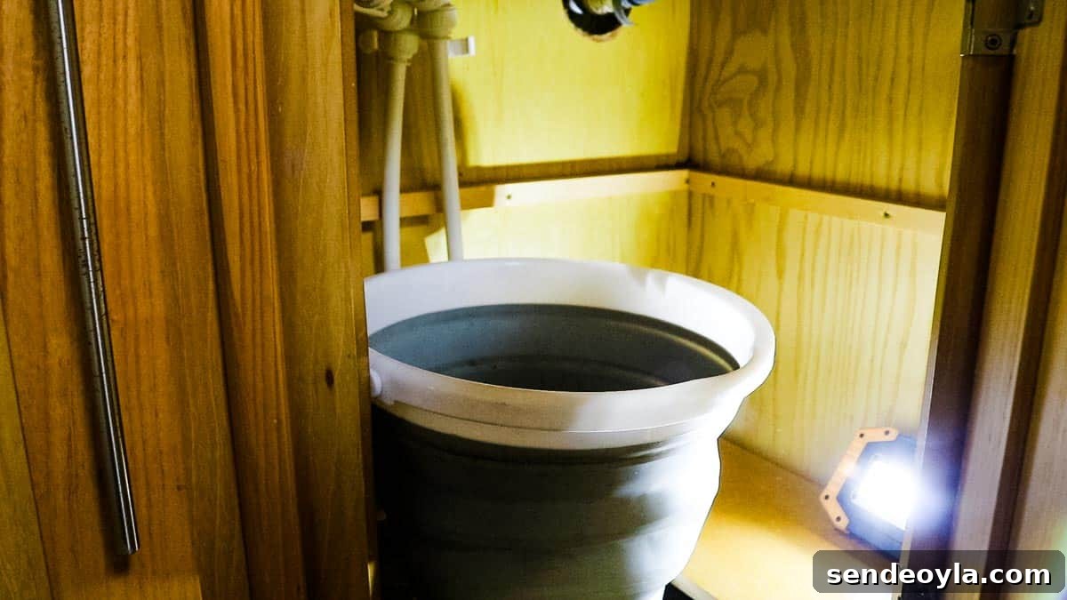 How to Replace a Mixer Tap on a Narrowboat or in Your Home 5 Collapsible bucket under a bathroom sink to do plumbing