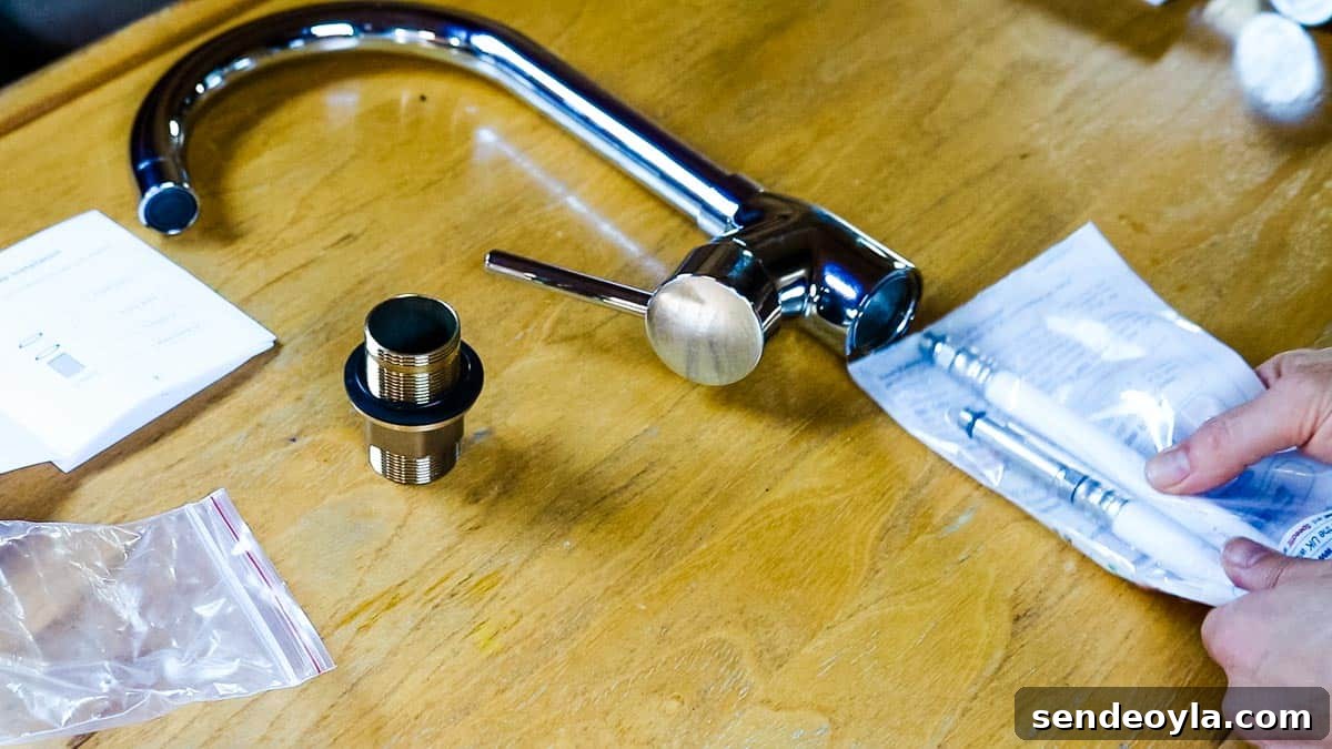 How to Replace a Mixer Tap on a Narrowboat or in Your Home 8 New mono mixer tap laid out on a table with Speedfit hoses