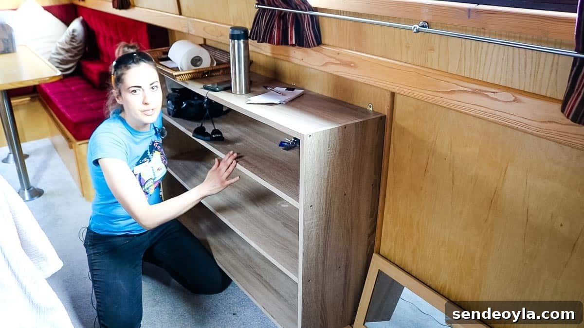 Inside a 57ft Reverse-Layout Narrowboat: Interior Tour 12 Gunnel boat storage with wall mounted book shelf