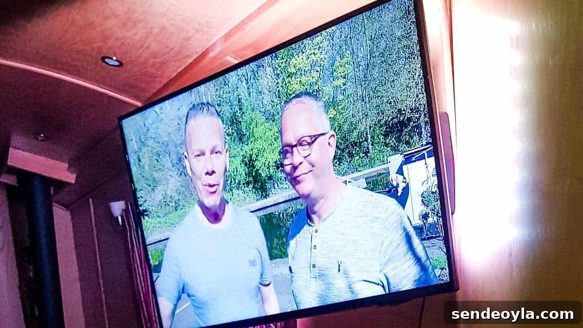 Inside a 57ft Reverse-Layout Narrowboat: Interior Tour 13 Ambient lighting TV on a narrowboat watching Foxes Afloat YouTube channel