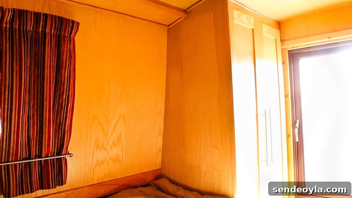 Inside a 57ft Reverse-Layout Narrowboat: Interior Tour 21 Ash ply lined wardrobe in a narrowboat bedroom