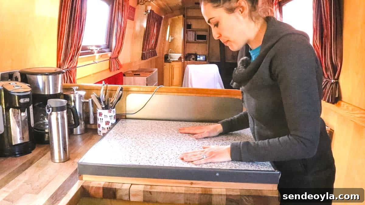 Inside a 57ft Reverse-Layout Narrowboat: Interior Tour 5 Worktop space saver on a galley kitchen