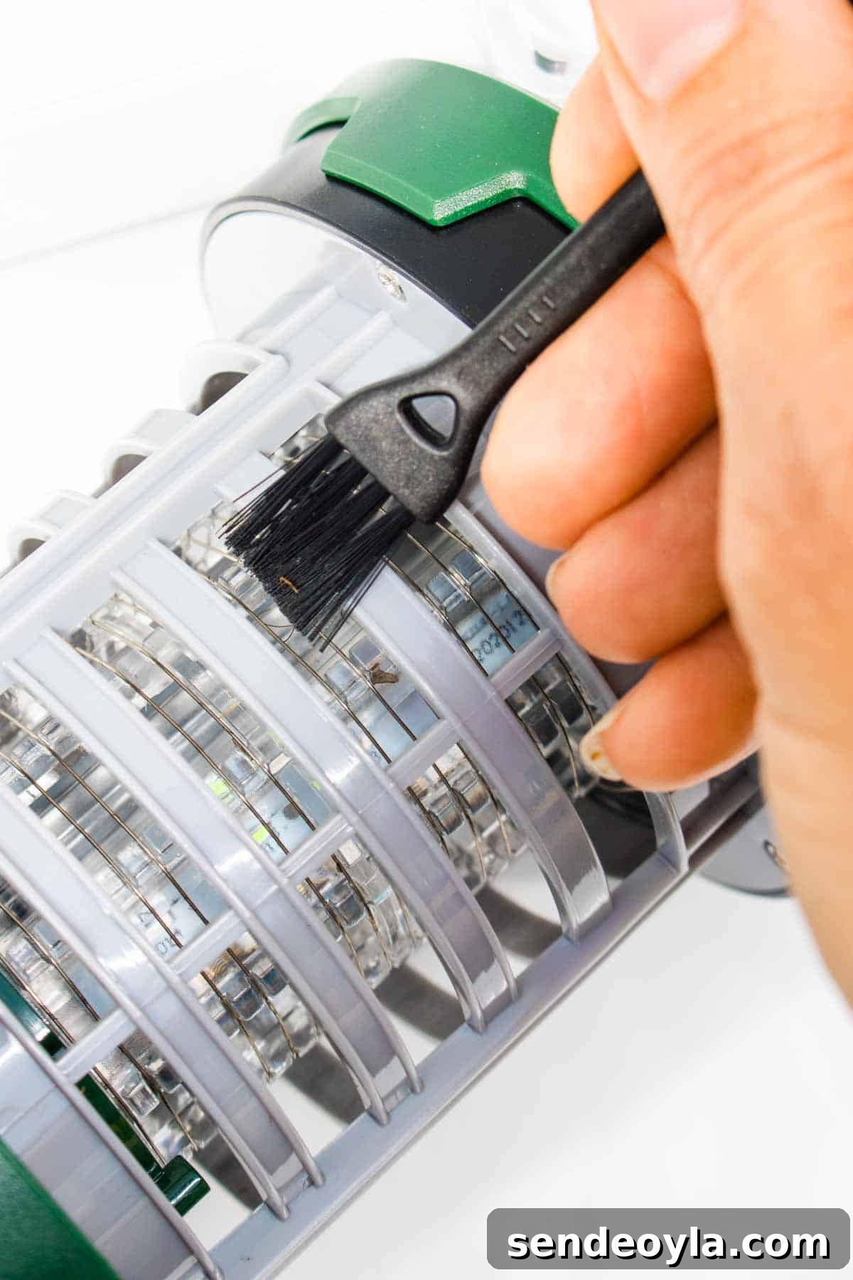 Insect-O-Cutor Nomad Fly Killer: Hands-On Review 8 Brushing away dead flies in a light trap
