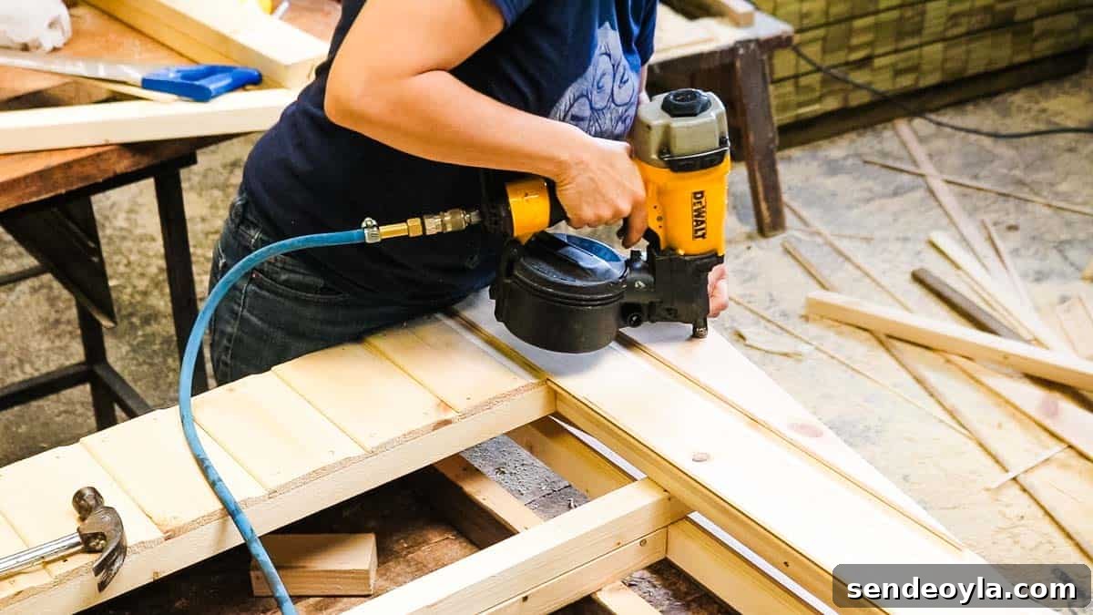 How to Build a Lean-To Shed with Free Plans 14 Nailing a flat packed shed frame for angled roof