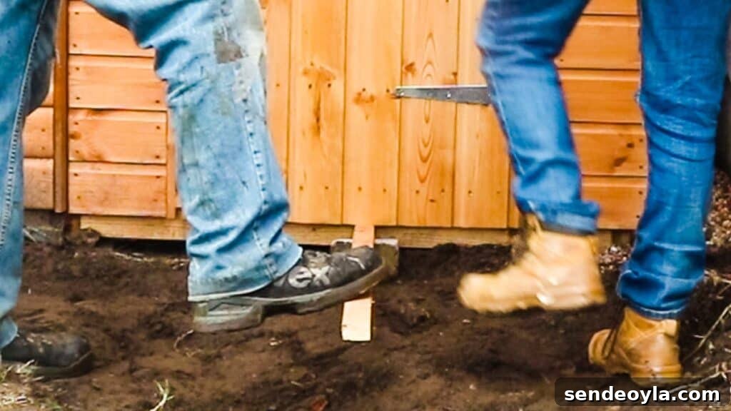 How to Build a Lean-To Shed with Free Plans 20 Propping up shed door with wood and brick