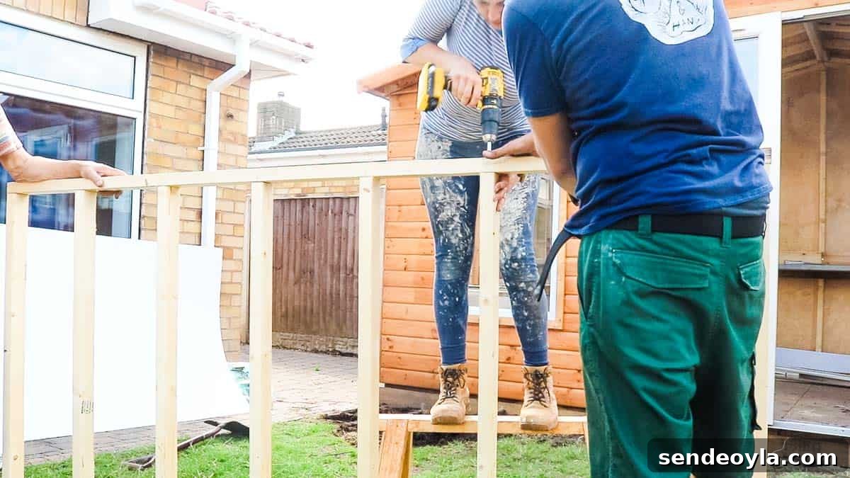 How to Build a Lean-To Shed with Free Plans 6 Woman screwing shed base together using CLS