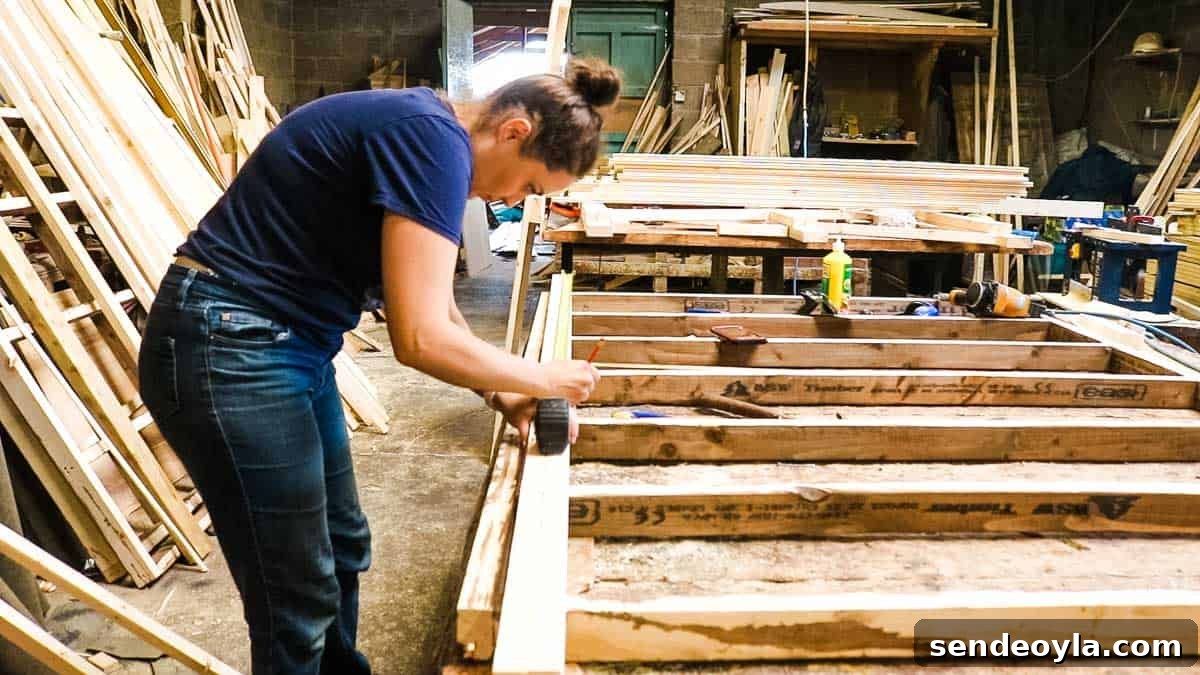 How to Build a Lean-To Shed with Free Plans 8 Female DIY blogger marking spars on timber