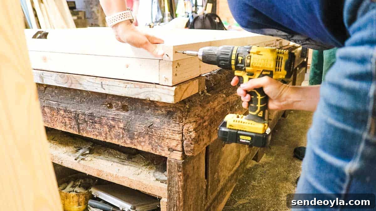 How to Build a Lean-To Shed with Free Plans 9 Screwing shed panel together