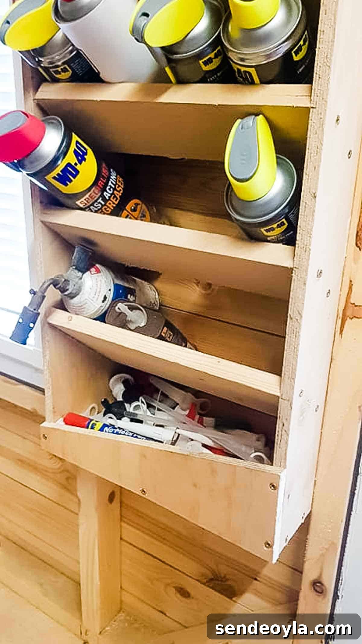 DIY Silicone Caulk Tube Organizer and Sealant Rack 4 Close up of WD-40 cans in 45 degree angled shelves