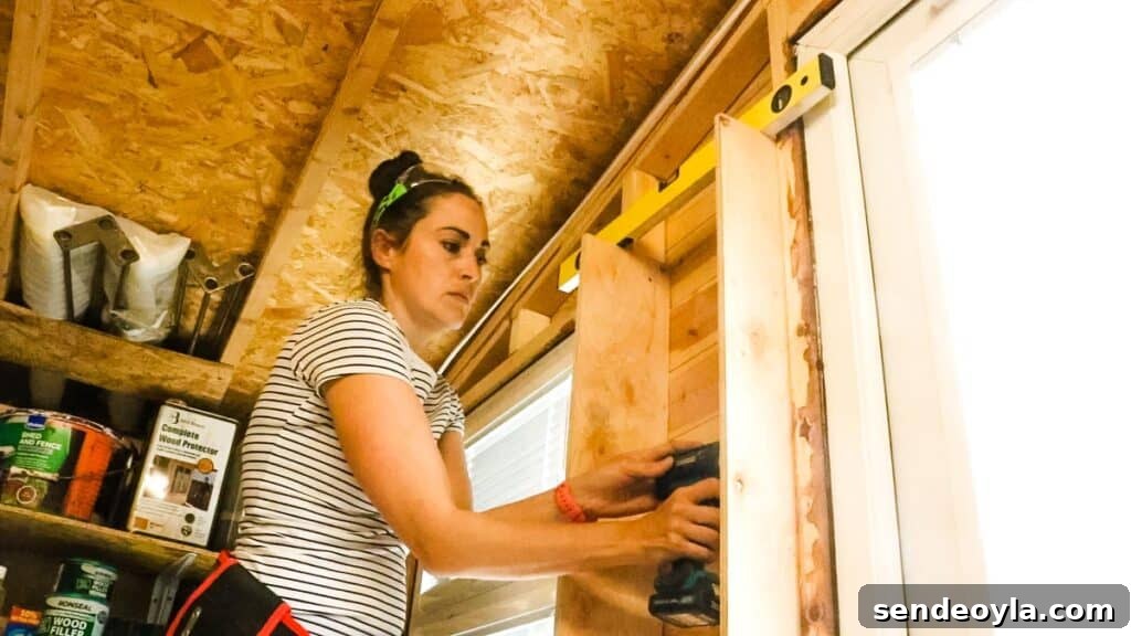 DIY Silicone Caulk Tube Organizer and Sealant Rack 5 Woman screwing plywood strips inside shed batons to extend a shelf storage space
