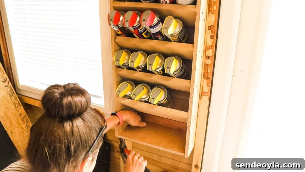 DIY Silicone Caulk Tube Organizer and Sealant Rack 10 Woman adding a bottom shelf for caulk nozzles