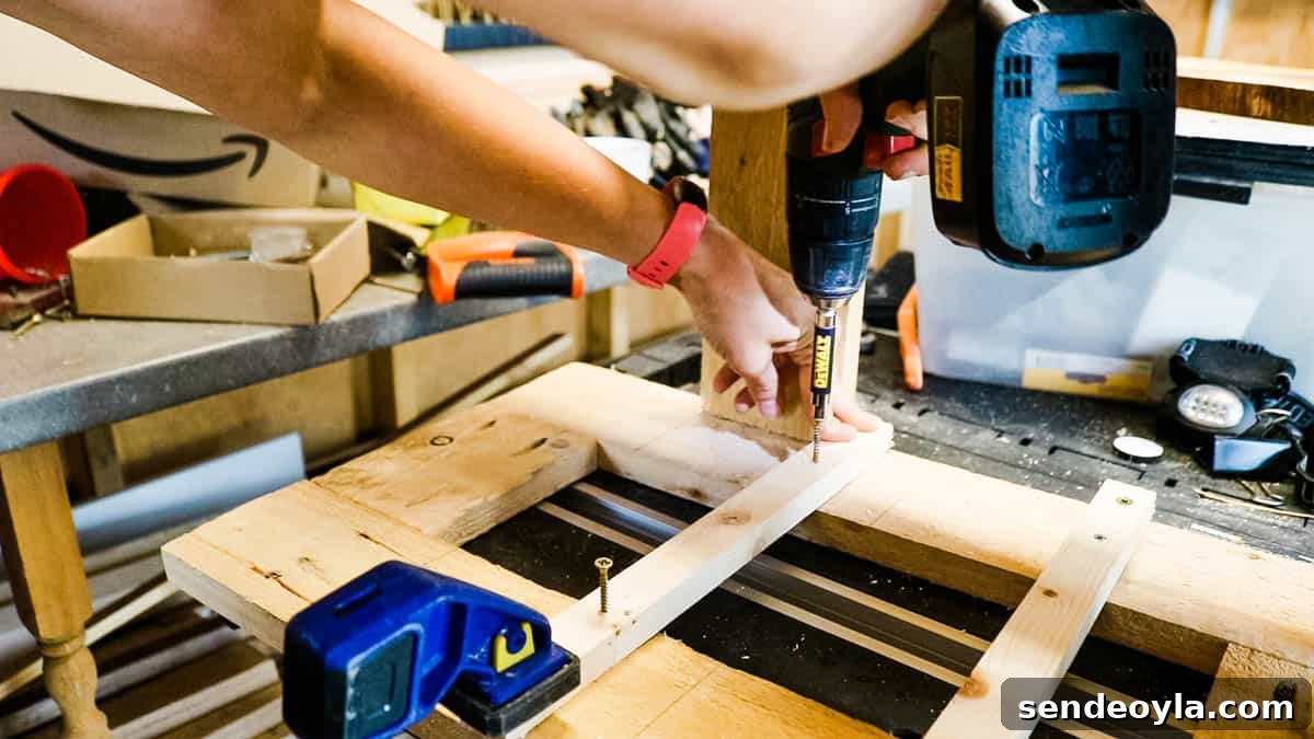 DIY Drawer Boxes for Workshop Storage: Step-by-Step Plans 10 Basic wooden batons being screwed to a drawer support as easy runners