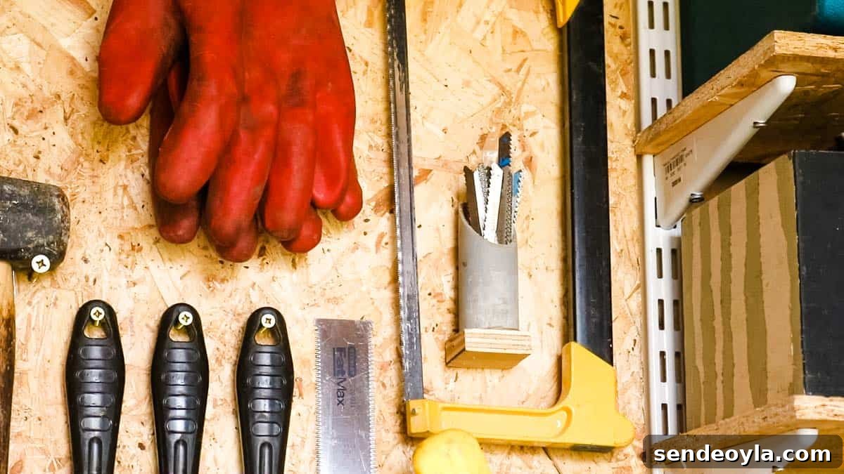 Quick DIY Wall-Mounted Tool Organizer for Garage 9 jigsaw blades in a plastic pipe with plywood base on a tool wall storage in a workshop