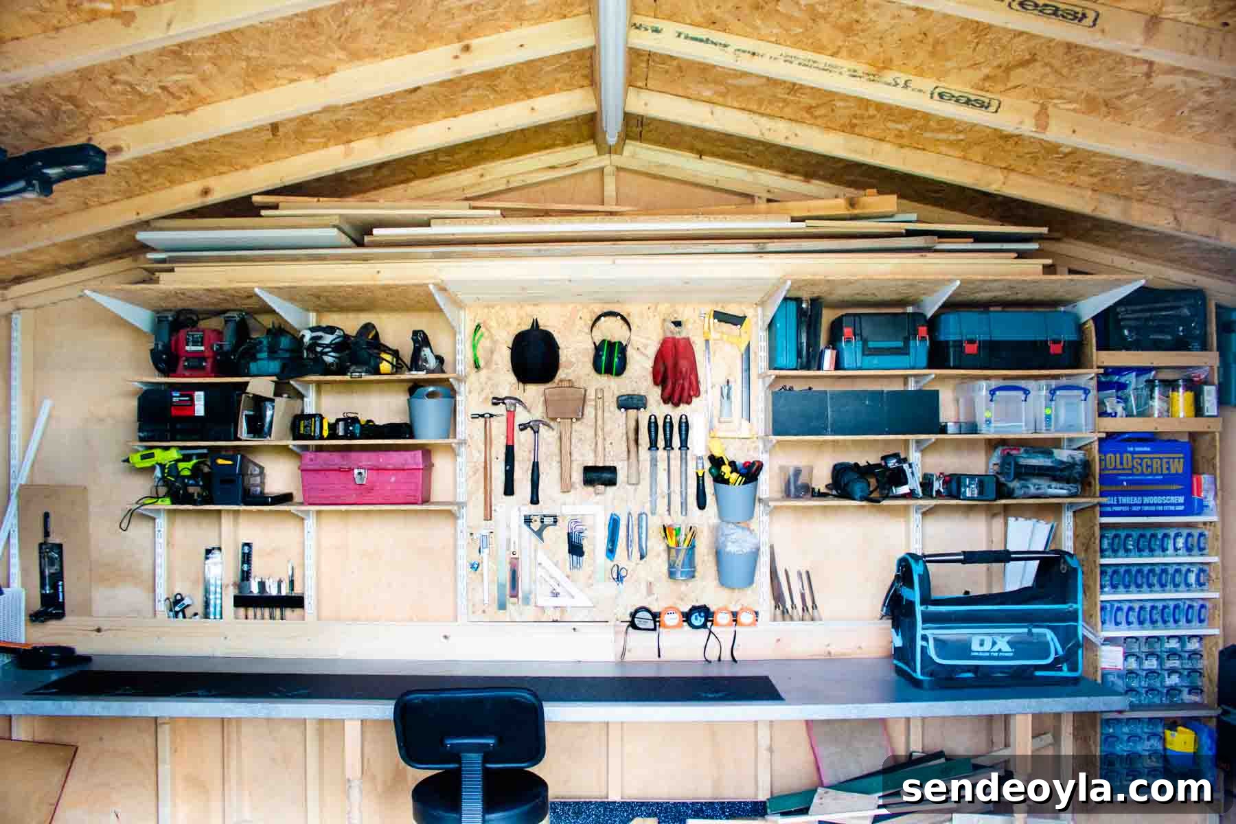 Quick DIY Wall-Mounted Tool Organizer for Garage 10 DIY tool box wall solution with a workbench and chair in a tool workshop
