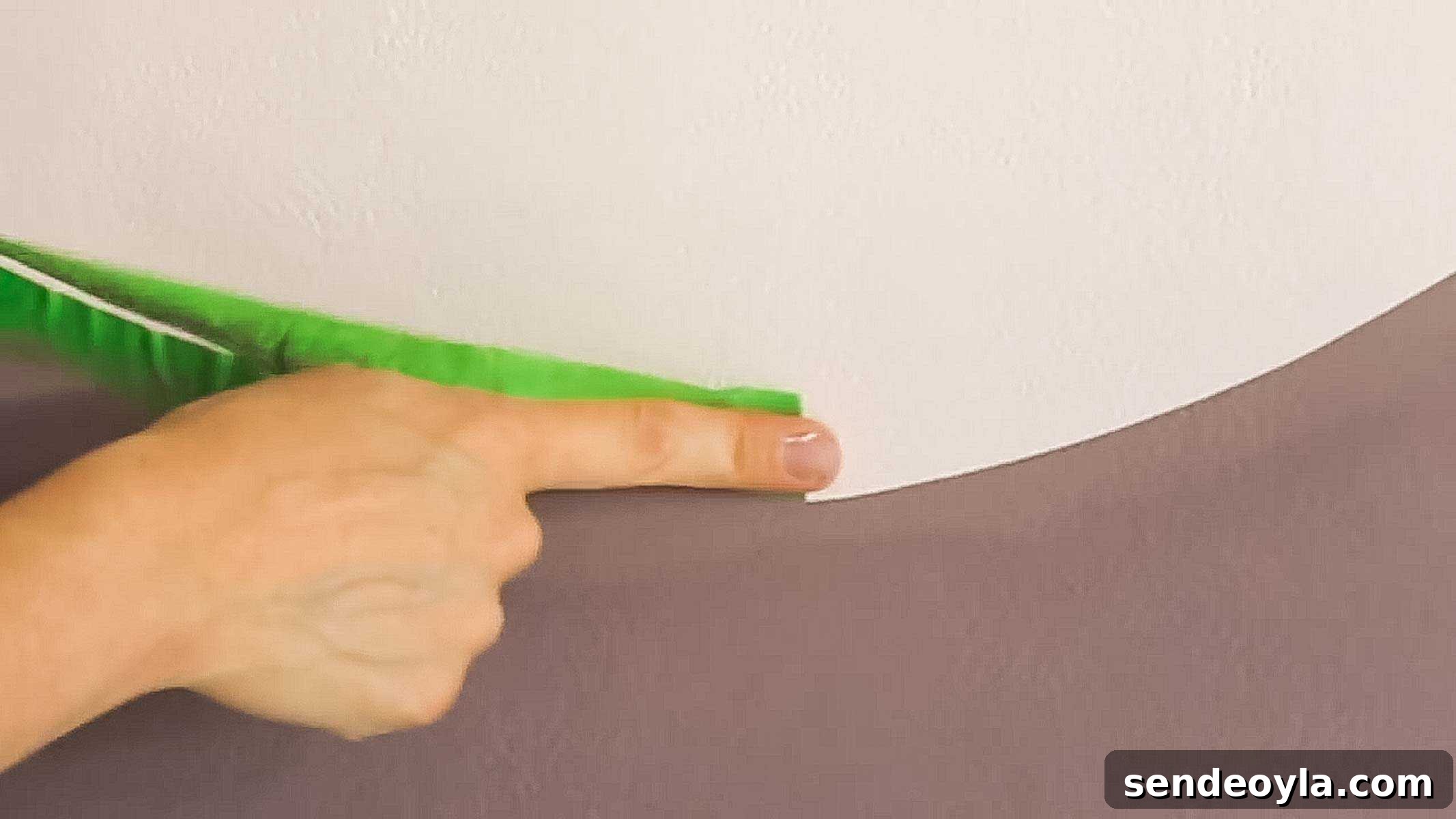 How to Decorate a Room: Practical Tips for Beginners 13 removing frog tape off a painted wall carefully without ruining paintwork