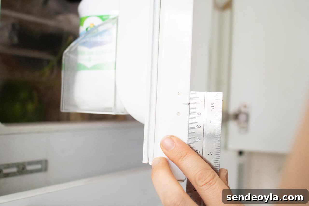 How to Install an Integrated Fridge-Freezer Door Slider 4 Combination square working half way of the fridge indents
