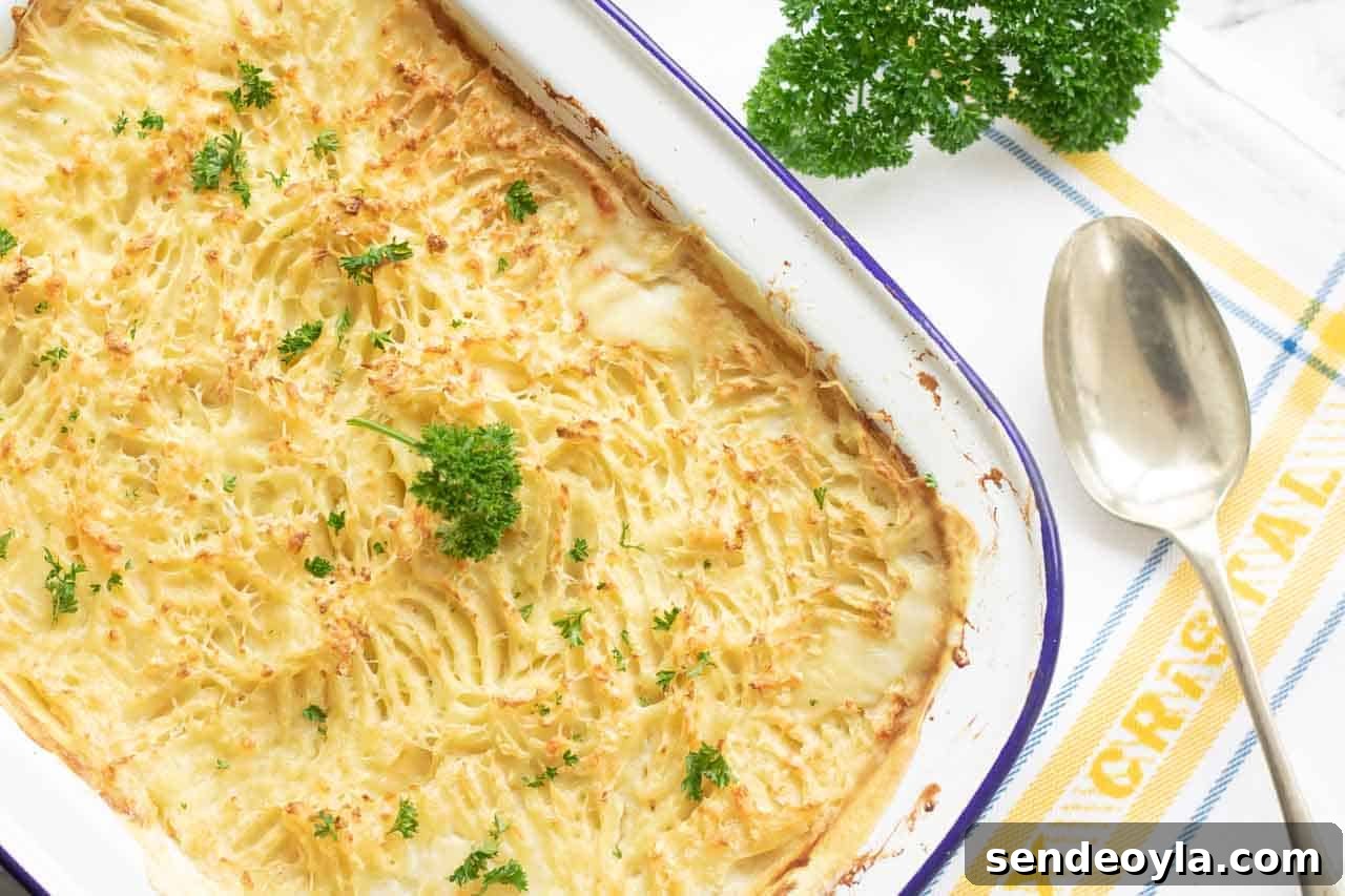 Fish Pie Recipe with Lemon Dill Cream Sauce 3 Uncut fish pie with grooved topping and fresh parsley