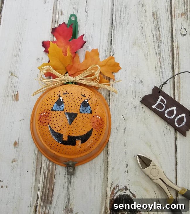DIY Halloween Decorations from 20 Household Items 6 Strainer as Jack O Lantern from Mixed Kreations, 15 Household Items Re-purposed for Halloween Decor www.theboondocksblog.com