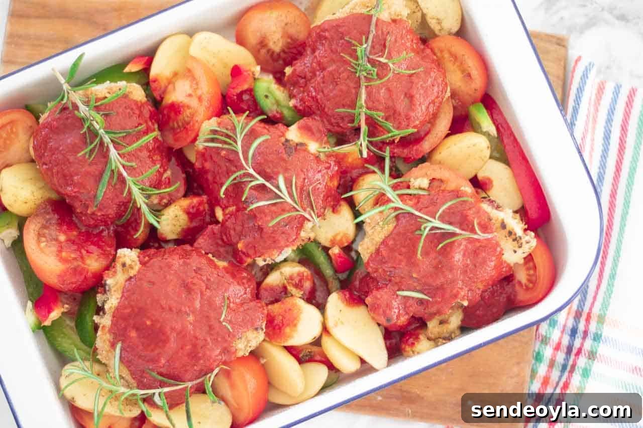 Full roasting tray with chicken coated in chilli sauce
