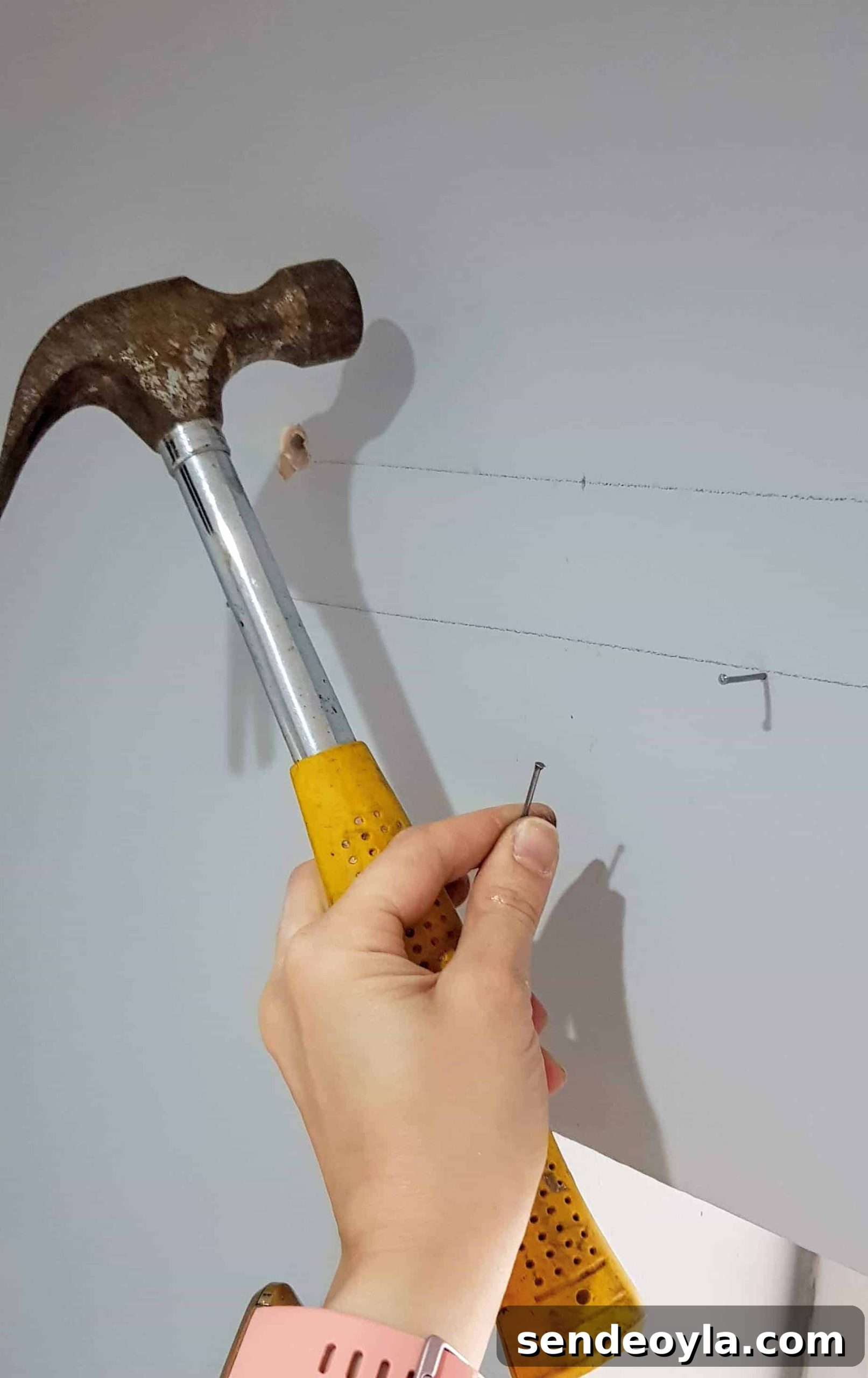 How to Install a Curtain Pole Batten with Grab Adhesive 8 hammering tack pins in wall to prop up curtain pole batten