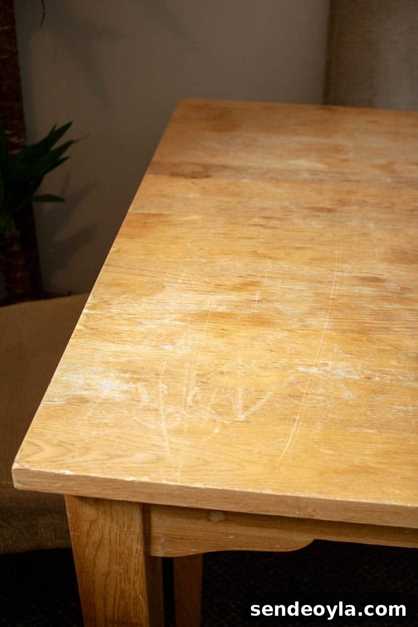 Refinish Oak Furniture: DIY Restoration Guide 4 before shot of scratched and sun damaged oak dining table from dump it site.