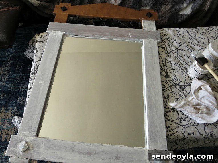 Curbside Mirror Makeover: Revamp Thrifted Mirrors 4 Painting the mirror with chalky finish paint in white, How to Makeover a Curbside Mirror the Lazy Way www.theboondocksblog.com