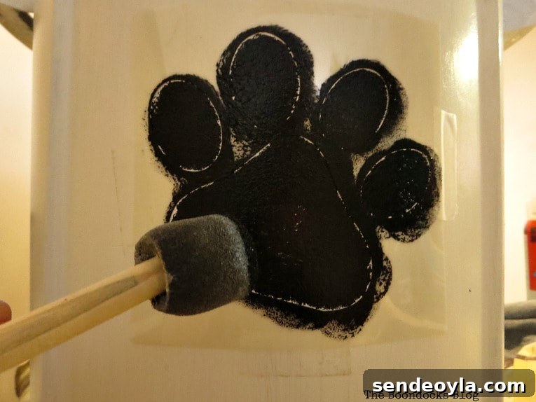 DIY Airtight Dog Food Storage Container 8 Stenciling a paw with a pounce sponge.