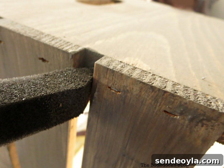 Stain Wooden Crates for a Professional Finish 6 Applying barnwood stain between slats of wooden crate