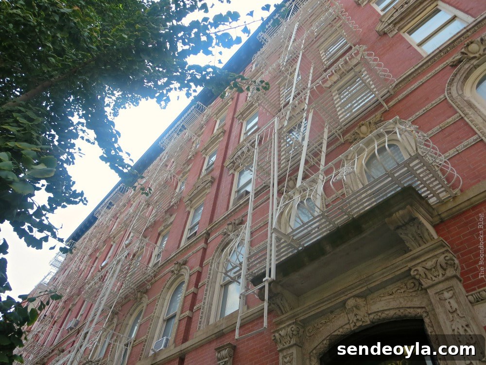 Typical building with ornate features and fire escapes, A monumental Surprise at Hudson Square in New York, www.theboondocksblog.com