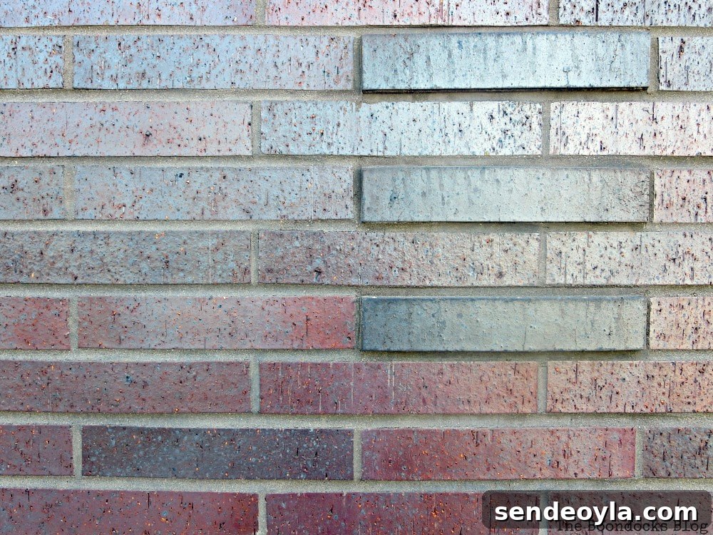 Maroon masonry base of building, A monumental Surprise at Hudson Square in New York, www.theboondocksblog.com