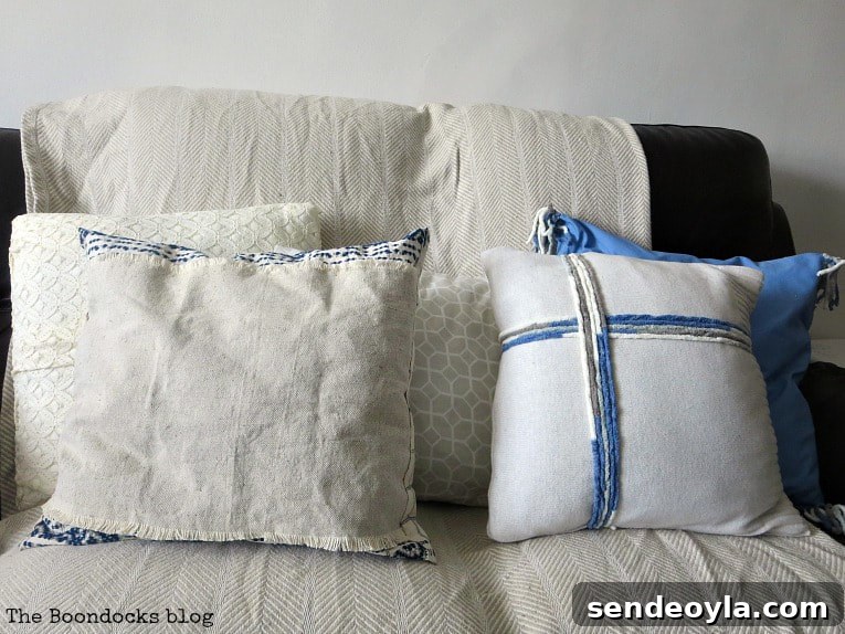 15 DIY Upcycle Ideas for Old Clothes 13 White throw pillows on a couch.