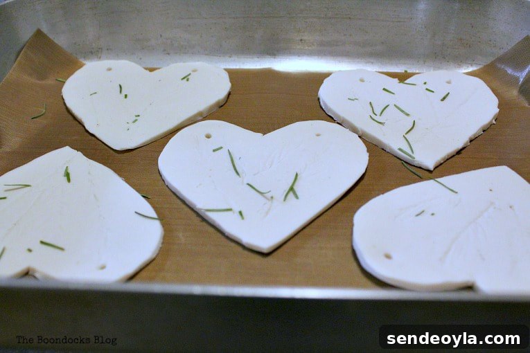 Clay hearts placed on a baking tray