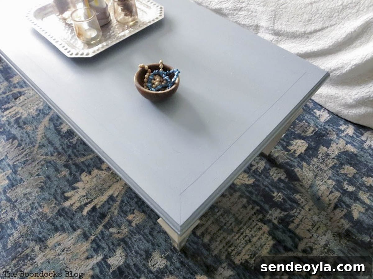 DIY Thrifted Coffee Table Makeover for a Modern Home 7 Painted table showing blue top and beige base