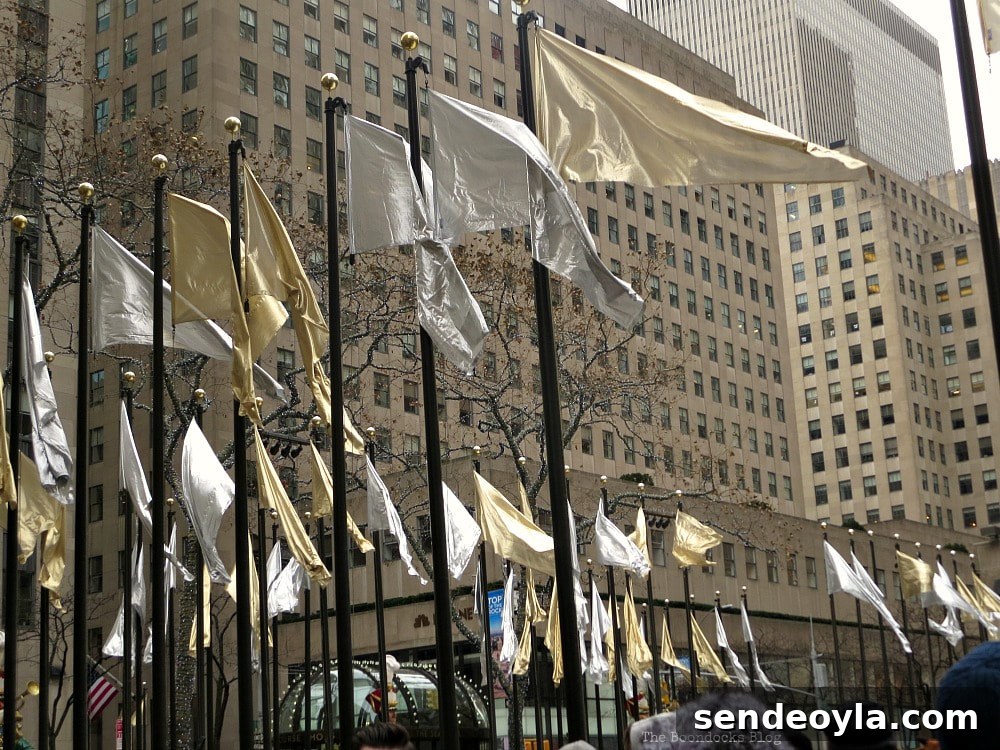Silver and Gold Flags surround the plaza, A Visit to the Spectacular Tree at Rockefeller Center www.theboondocksblog.com