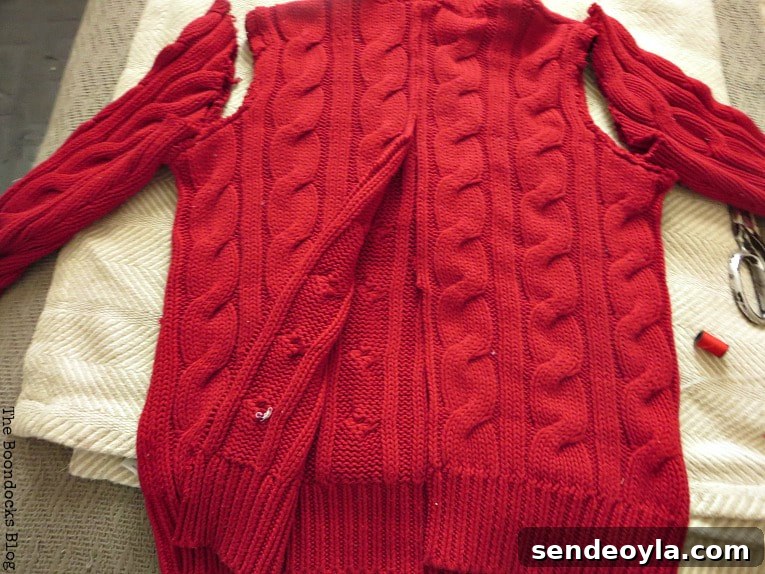 How to Make Christmas Stockings from Old Sweaters 4 cutting the sweater in half, How to Make Easy Christmas Stockings from Sweaters